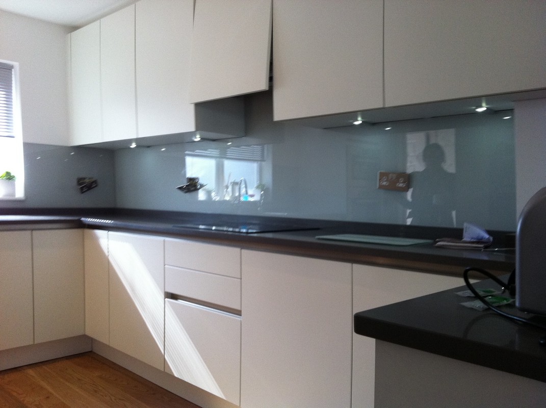 Grey glass kitchen splashback with LED lighting in Pimlico