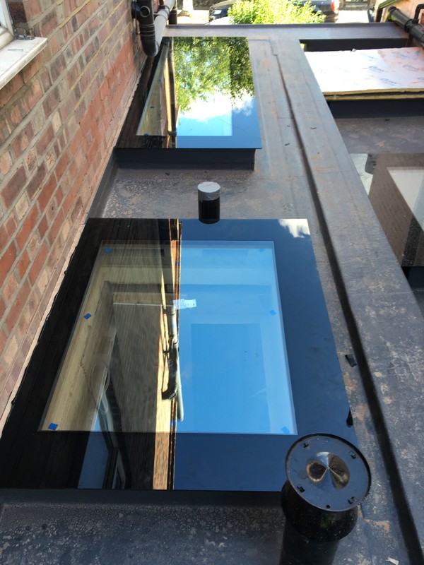 Multiple flat roof skylights on extension in Pimlico