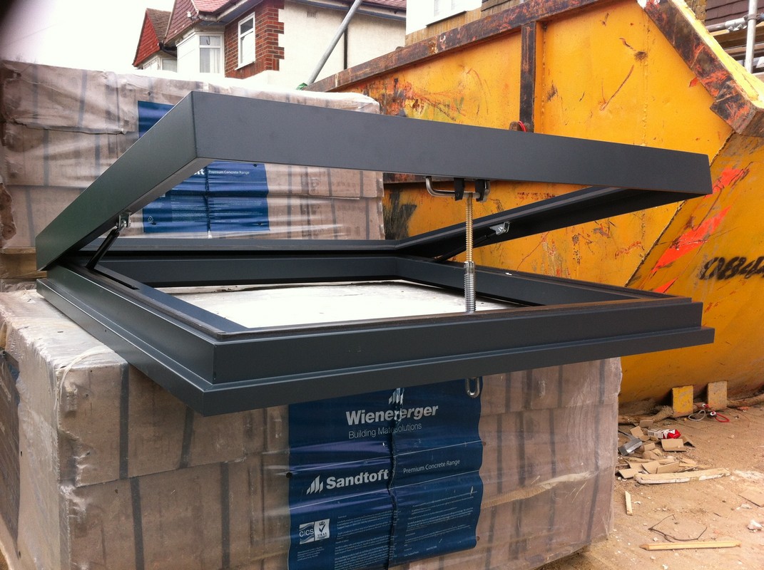 Opening flat roof skylight in anthracite grey installed in Pimlico